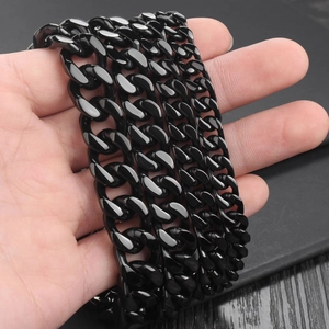 Polished black stainless steel Cuban link chain bracelet held in hand for men's fashion