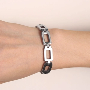 Minimalist stainless steel hollow chain bracelet for women on wrist in silver finish