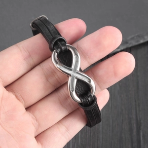 Men's multilayer black leather bracelet with silver infinity cross charm and magnetic clasp