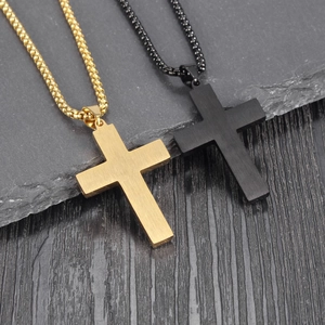 Cross pendant necklaces in gold and black finishes with brushed metal texture and bead chain