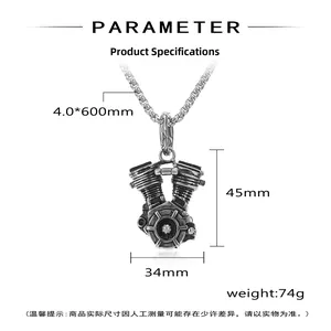 Close-up of vintage steel motorcycle engine pendant with detailed cooling fins and chain