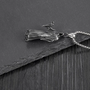 Detail of gothic reaper pendant in vintage silver finish with durable box chain necklace