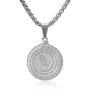 Macro detail of silver stainless steel prayer pendant with Serenity Prayer text