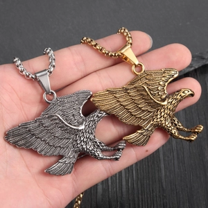 Mens punk eagle pendant necklace in silver and gold finish with spread wings design
