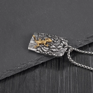 Rugged stainless steel necklace with textured bark finish and golden gecko pendant