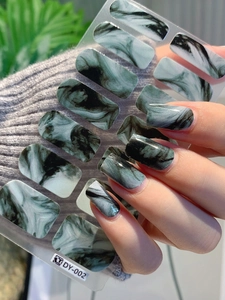 Detailed view of ink marble texture nail stickers with realistic glossy finish and fit