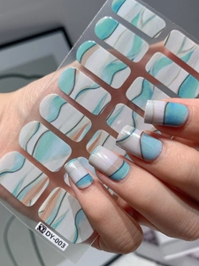 Detailed view of DY-003 nail stickers featuring blue marble texture and ink patterns