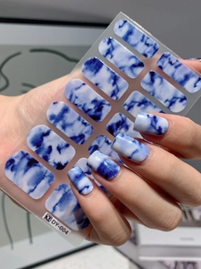 Detailed blue marble texture nail stickers with ink wash style and translucent finish