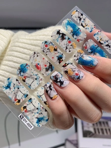 Detailed view of DY-005 self-adhesive nail wraps with artistic ink marble splash patterns