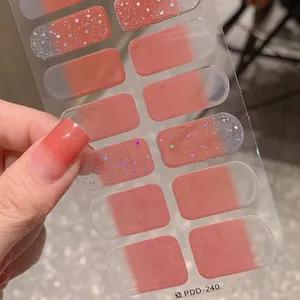 Autocollants pour ongles dégradés roses avec paillettes sur support transparent
