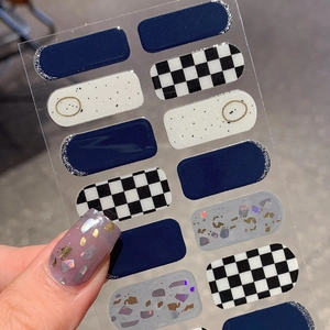 Deep blue and cream plaid nail stickers with glitter finish and marble textures