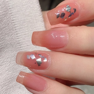 Long square pale orange French gradient nail stickers with silver foil glitter accents