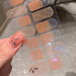 French gradient nail stickers in nude and orange tones with laser glitter finish