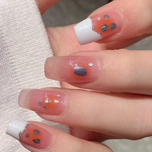 French blush gradient press-on nails with silver glitter and white tips on knit sleeve