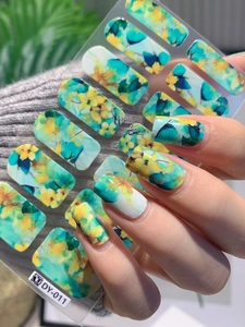 Detailed close-up of self-adhesive nail art stickers with watercolor marble floral patterns