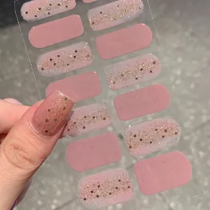 Glitter pink self-adhesive nail stickers with gold sparkle design for a perfect manicure