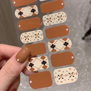 Caramel brown self-adhesive nail stickers with vintage argyle and floral patterns