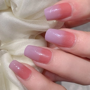 Elegant lavender gradient press-on nails with fine glitter finish and glossy texture