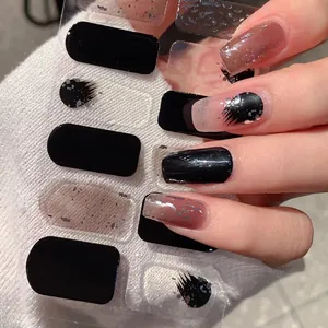 Press-on nails in black and coffee tones with silver glitter and artistic marble design
