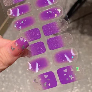 Purple gradient nail stickers with silver glitter and butterfly patterns for manicures