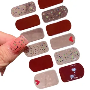 Glossy burgundy Valentine's Day nail stickers with red hearts and glitter accents