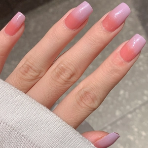 Light purple ombre fake nails with fine glitter finish in medium square oval shape