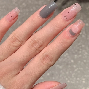 Glossy medium square press-on nails in grey and speckled pink geometric design