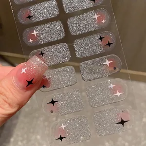 Pink gradient glitter nail stickers with white and black star patterns for women