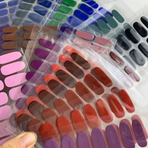 Close-up of assorted solid color semi-cured gel nail stickers in vibrant various shades