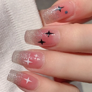 Pink gradient press-on nails with silver glitter and star designs in square shape