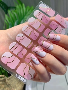 Detail of pink marble nail stickers with gold veins and application on nails, style DY-021