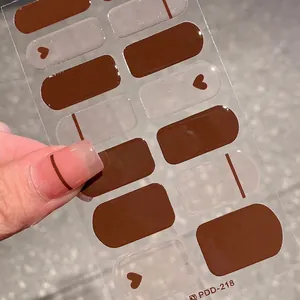Dark brown heart and stripe nail stickers for autumn with a glossy resin finish