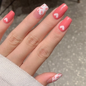 Pink heart and cow print nail art stickers on square fingertips with a fresh girlish style