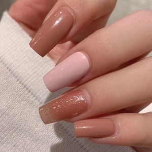 Gentle nude pink and bronze glitter self-adhesive nail polish wraps on square nails