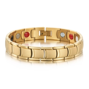 Macro detail of men's gold magnetic therapy bracelet with inset health stones