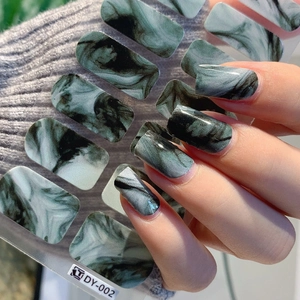 Self-adhesive marble texture nail stickers in dark green and black with cat-eye gloss