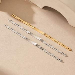 Detail of 6mm polished stainless steel watch-band bracelets in gold and silver finish