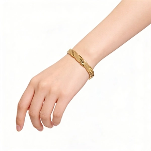 Detail view of the brushed texture and polished gold finish on this adjustable dragon bracelet