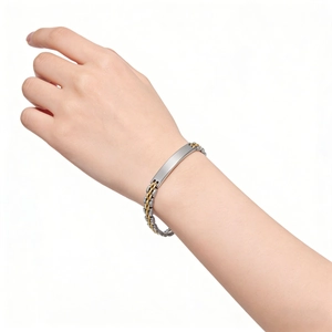 Macro shot of 6mm two-tone stainless steel watchband style bracelet with smooth blank ID tag