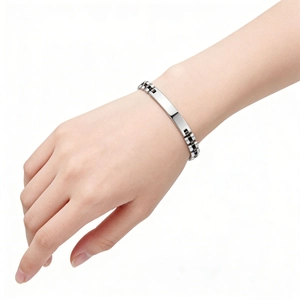 Polished stainless steel 6mm watch-style strap bracelet with ID bar shown on wrist