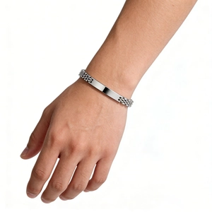 Detail of 6mm polished stainless steel watch band bracelet with engravable metal plate