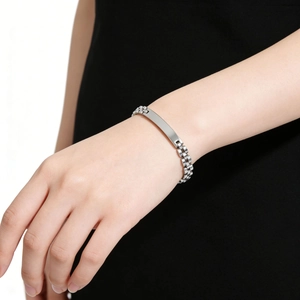 Close-up of a 6mm silver stainless steel bracelet with a polished rectangular plate