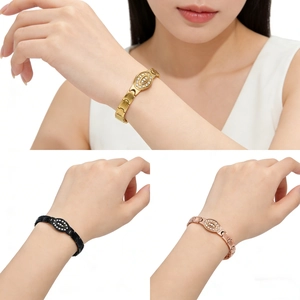 Detail of luxury stainless steel bracelets with diamond-set eye charms in three finishes