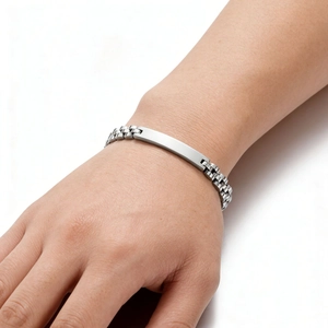 Macro view of 6mm polished stainless steel watchband bracelet with a smooth blank plate