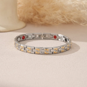 Stainless steel magnetic bracelet with Greek key pattern in silver and gold dual tones