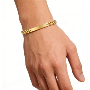Detailed view of a gold-plated 6mm ID bracelet with a polished rectangular bar and link band