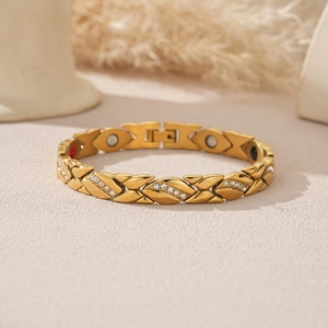 Goldenes Magnettherapie-Armband mit X-Glied-Design und weißen Kristallsteinen