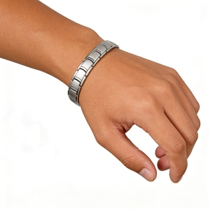 Detail of silver stainless steel chain bracelet with matte finish on a male wrist