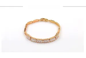 Detail of 18K gold plated tennis bracelet with square-cut cubic zirconia stones