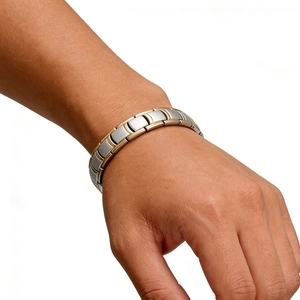 Detailed shot of two-tone stainless steel magnetic bracelet with industrial link design